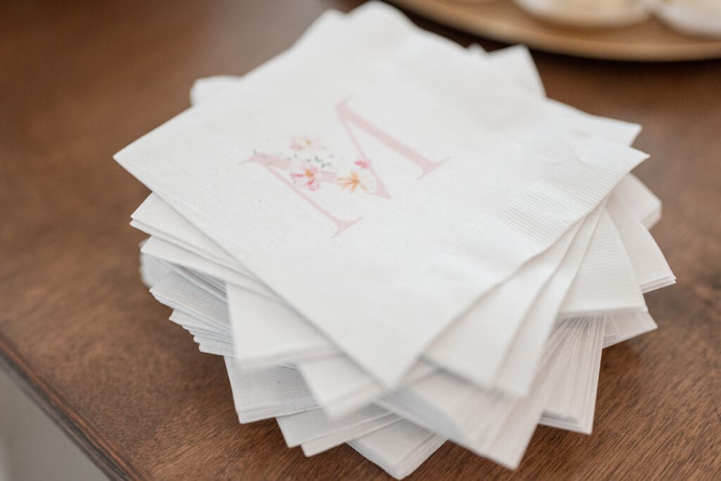 Custom Monogram Napkins as wedding details across a bar.